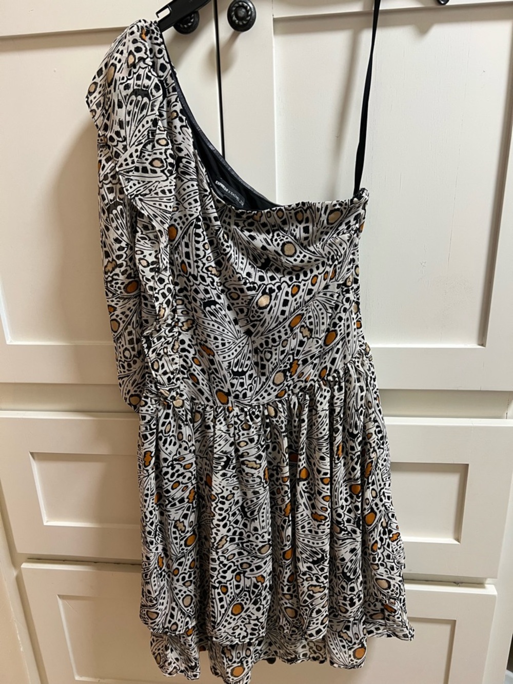 Express One-Shoulder Black and White Dress with Gold Dot Accents